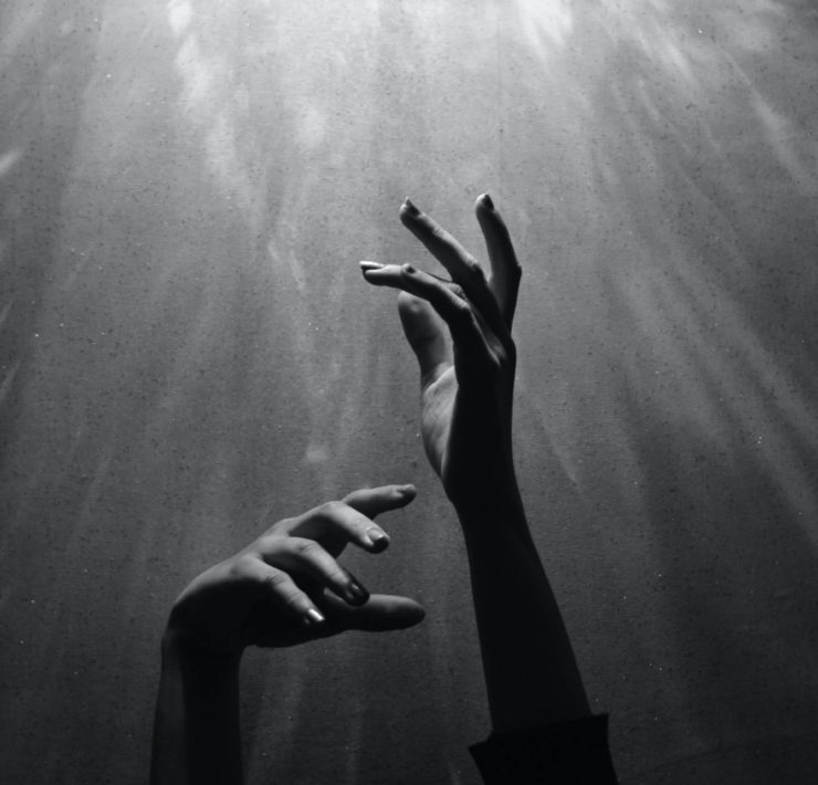 Hands reaching out to God