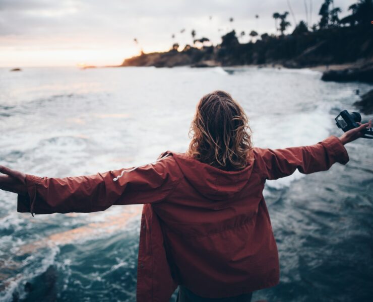 person standing near body of water