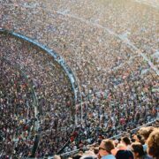 people sitting inside stadium seats