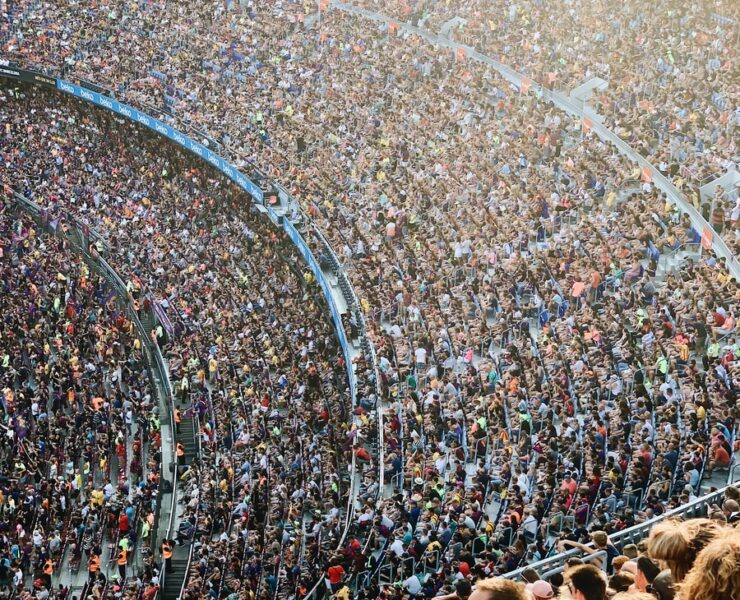 people sitting inside stadium seats