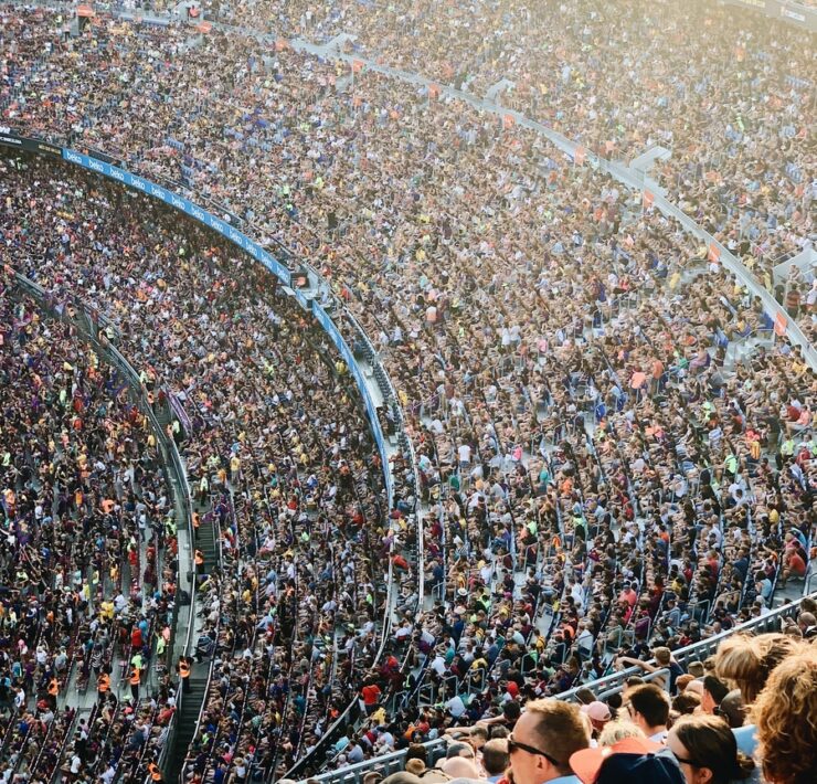 people sitting inside stadium seats